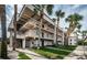 Two-story building with balconies, stairs and landscaping at 8693 Bardmoor Blvd # 202B, Seminole, FL 33777