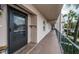 Exterior view of building showcasing a walkway, building entrance, and landscaping at 8693 Bardmoor Blvd # 202B, Seminole, FL 33777