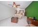 Living room with green accent wall and view into dining area at 8693 Bardmoor Blvd # 202B, Seminole, FL 33777