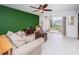 Living room features a sofa, recliner, and access to a balcony at 8693 Bardmoor Blvd # 202B, Seminole, FL 33777