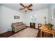 Cozy office with wood floors and ceiling fan at 8693 Bardmoor Blvd # 202B, Seminole, FL 33777