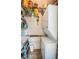 Stackable washer and dryer in a compact laundry room with storage at 8693 Bardmoor Blvd # 202B, Seminole, FL 33777