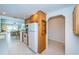 Kitchen features ample wood cabinets and a view into the adjacent living area at 8693 Bardmoor Blvd # 202B, Seminole, FL 33777