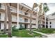 Two-story building with balconies and lush landscaping at 8693 Bardmoor Blvd # 202B, Seminole, FL 33777