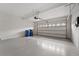 Spacious garage with white walls and epoxy floor at 11006 Tahiti Isle Ln, Tampa, FL 33647