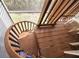 Wooden spiral staircase leading to a deck at 909 Harbour House Dr, Indian Rocks Beach, FL 33785