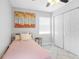 Well-lit bedroom with a twin bed and large closet at 7201 15Th N St, St Petersburg, FL 33702