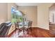 Breakfast nook with a glass table and chairs, overlooking the backyard at 22531 Eagles Watch Dr, Land O Lakes, FL 34639