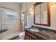 Bathroom with granite countertop and walk-in shower at 22531 Eagles Watch Dr, Land O Lakes, FL 34639