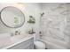 Modern bathroom with marble tile and a bathtub at 22531 Eagles Watch Dr, Land O Lakes, FL 34639