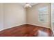 Spacious bedroom with hardwood floors and a large window at 22531 Eagles Watch Dr, Land O Lakes, FL 34639