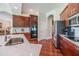 Modern kitchen with stainless steel appliances and hardwood floors at 22531 Eagles Watch Dr, Land O Lakes, FL 34639
