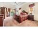 Main bedroom with large bed and access to backyard at 22531 Eagles Watch Dr, Land O Lakes, FL 34639