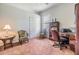 Home office with wood desk and two chairs at 22531 Eagles Watch Dr, Land O Lakes, FL 34639