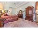 Main bedroom with a dresser and large bed at 22531 Eagles Watch Dr, Land O Lakes, FL 34639