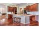 Modern kitchen with an island, stainless steel appliances, and hardwood floors at 22531 Eagles Watch Dr, Land O Lakes, FL 34639