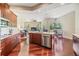 Open concept kitchen with stainless steel appliances and hardwood floors at 22531 Eagles Watch Dr, Land O Lakes, FL 34639