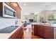 Open concept kitchen with an island and views into the living room at 22531 Eagles Watch Dr, Land O Lakes, FL 34639