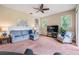 Spacious living room featuring comfortable seating and a large TV at 22531 Eagles Watch Dr, Land O Lakes, FL 34639