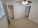 Bedroom with tile floors, ceiling fan, and mirrored closet doors at 8620 94Th Ave, Seminole, FL 33777