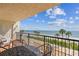 Relax on the balcony with seating and panoramic beach and ocean views at 14950 Gulf Blvd # 404, Madeira Beach, FL 33708