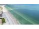 Expansive white sand beach with clear ocean waters, providing a serene coastal experience at 14950 Gulf Blvd # 404, Madeira Beach, FL 33708