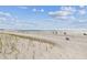 Expansive beachfront with views of the shoreline and ocean; a serene coastal lifestyle at 14950 Gulf Blvd # 404, Madeira Beach, FL 33708