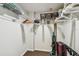 Walk-in closet providing generous space for storage, luggage and accessories at 14950 Gulf Blvd # 404, Madeira Beach, FL 33708
