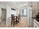 Eat-in kitchen has tile flooring, a window, and standard appliances at 14950 Gulf Blvd # 404, Madeira Beach, FL 33708