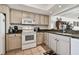 Kitchen with breakfast nook and view into living space at 14950 Gulf Blvd # 404, Madeira Beach, FL 33708