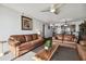 Comfortable living room featuring ocean views with sofas and ceiling fan at 14950 Gulf Blvd # 404, Madeira Beach, FL 33708