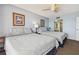 Bright bedroom features two beds, carpet, and decor with access to the attached bathroom at 14950 Gulf Blvd # 404, Madeira Beach, FL 33708