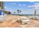 Outdoor seating area with picnic tables for relaxing by the ocean at 14950 Gulf Blvd # 404, Madeira Beach, FL 33708