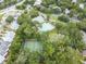 Community tennis courts and swimming pool from above at 3300 Fox Chase N Cir # 231, Palm Harbor, FL 34683