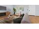 Living room with a comfortable layout, neutral decor, and hardwood floors at 3300 Fox Chase N Cir # 231, Palm Harbor, FL 34683