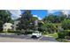 Two-story condo building with parking and landscaping at 3300 Fox Chase N Cir # 231, Palm Harbor, FL 34683