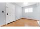 Bright entryway with light wood flooring and a white door at 3300 Fox Chase N Cir # 231, Palm Harbor, FL 34683