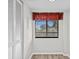 Small dining area with a window and red valance at 1933 Golfview Dr # 1933, Tarpon Springs, FL 34689