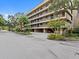 Exterior view of the building, showing landscaping and parking at 1933 Golfview Dr # 1933, Tarpon Springs, FL 34689