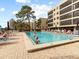 Inviting community pool with ample lounge chairs at 1933 Golfview Dr # 1933, Tarpon Springs, FL 34689