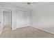 Bedroom with double closets and neutral walls and flooring at 1933 Golfview Dr # 1933, Tarpon Springs, FL 34689