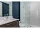 Contemporary bathroom with a walk-in shower and dark blue walls at 100 1St N Ave # 2501, St Petersburg, FL 33701