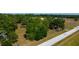 Aerial view of land with road and lush trees at 6191 Lockhart Rd, Brooksville, FL 34602