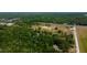 Aerial view of land with trees and nearby houses at 6191 Lockhart Rd, Brooksville, FL 34602