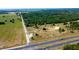 Aerial view of cleared land near a highway and farmland at 6191 Lockhart Rd, Brooksville, FL 34602