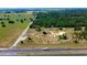 Aerial view of a property with cleared land and a highway at 6191 Lockhart Rd, Brooksville, FL 34602