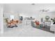 Open concept living and kitchen area with modern design and white cabinets at 5530 & 5530 1/2 7Th N Ave, St Petersburg, FL 33710