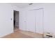 Simple bedroom with double door closet and neutral wall colors at 219 6Th Sw Ave, Largo, FL 33770