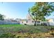 Backyard view of the house with mature trees at 219 6Th Sw Ave, Largo, FL 33770
