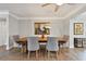 Bright dining room with hardwood floors and a rustic wooden table at 2200 W Bay Isle Se Dr, St Petersburg, FL 33705